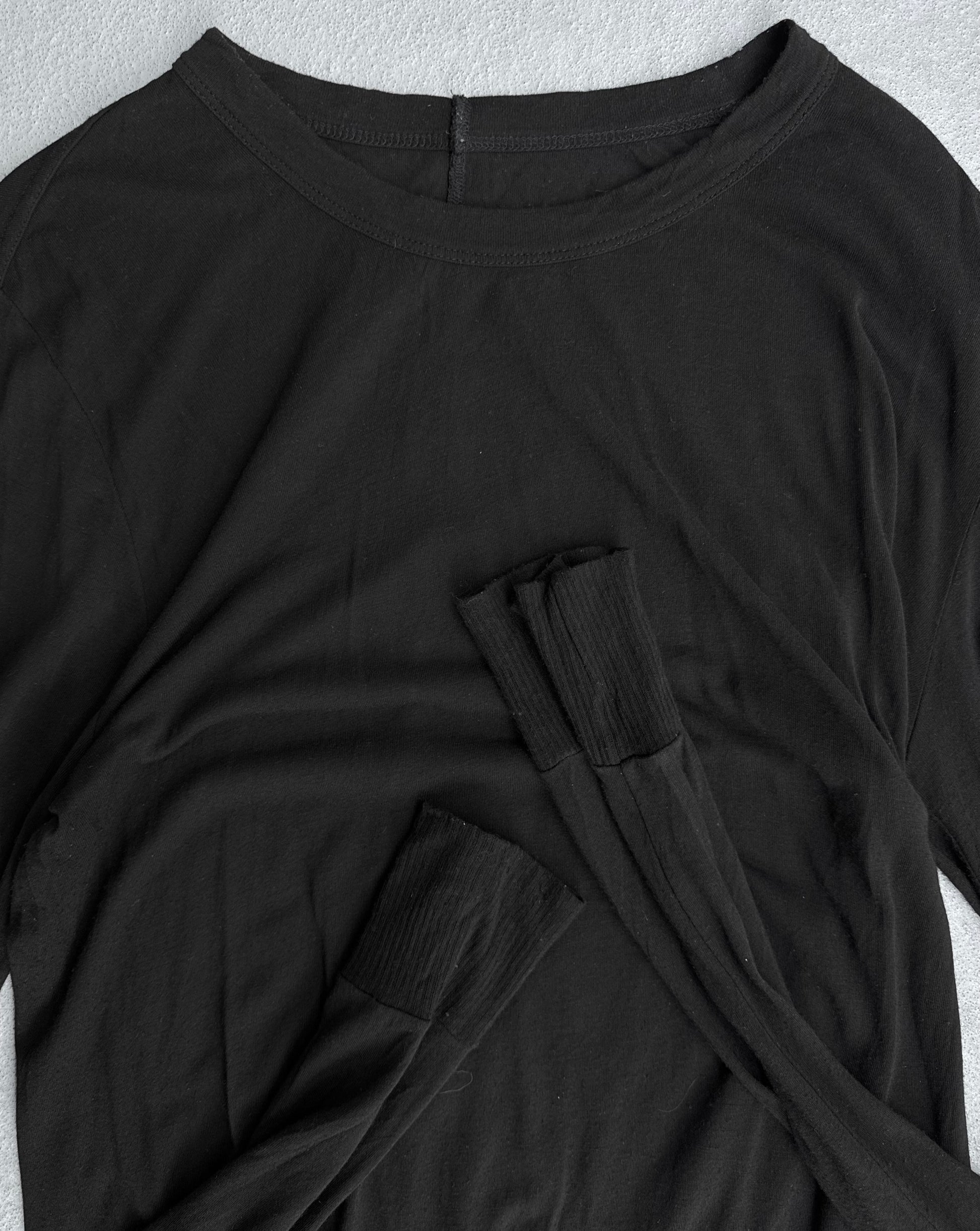 A Rick Owens SS16 “CYCLOPS” black silk-blend sheer long-sleeve shirt, size XL, is laid flat on a light gray surface with sleeves crossed. Condition 9/10.