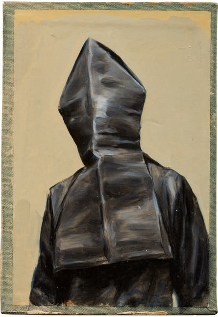 A figure clad in a dark, angular hood reminiscent of Undercover’s AW16 ‘Borremans’ Full-zip Fishtail Nylon Parka stands before a plain beige background, evoking the avant-garde edge of Jun Takahashi’s designs.