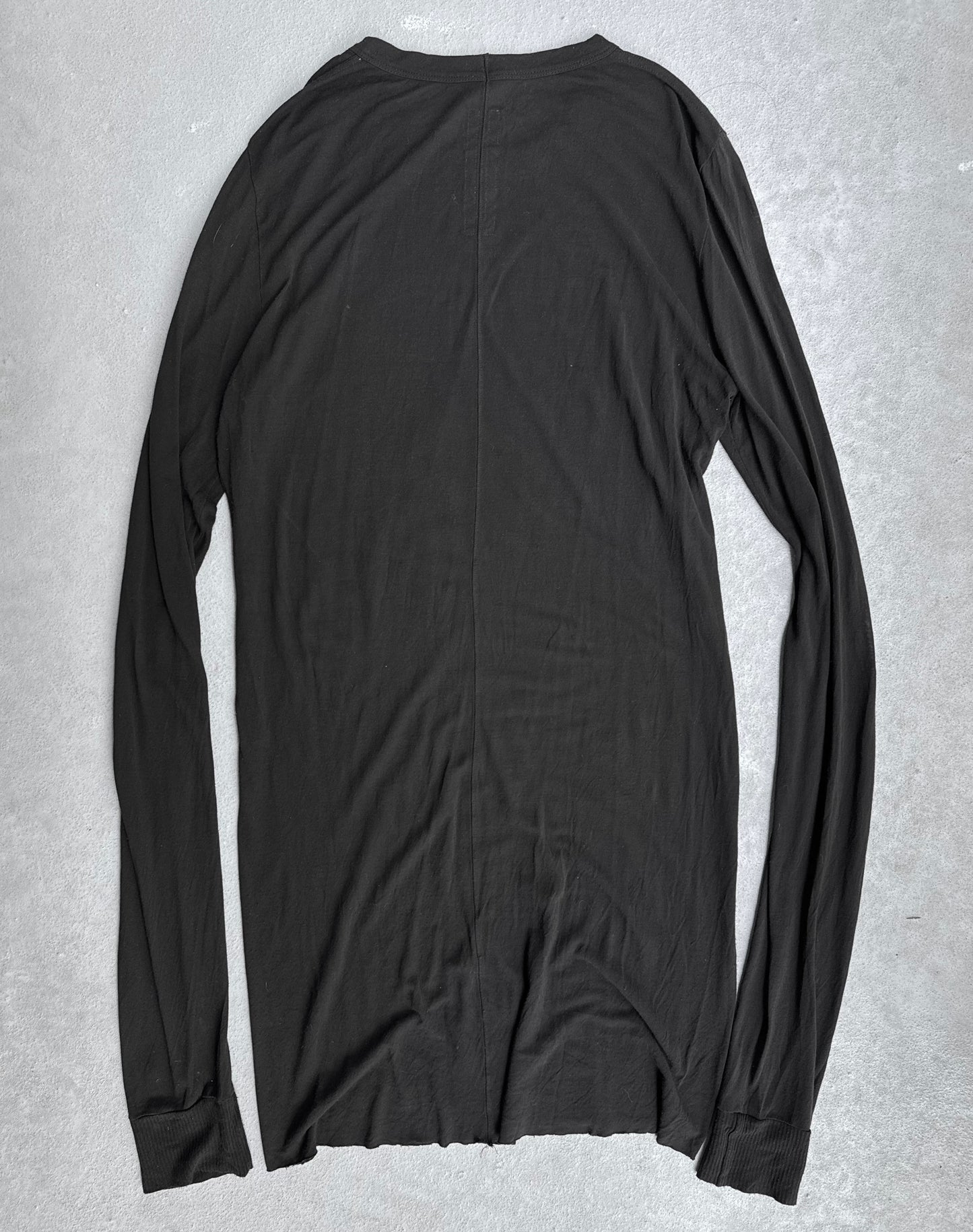 A Rick Owens SS16 “CYCLOPS” black silk-blend sheer long-sleeve shirt in size XL lies flat on a light gray surface, shown from the back. Minimalist design with no visible patterns or logos. Condition 9/10.