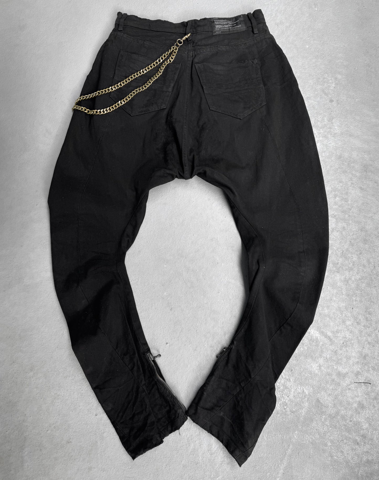Julius_7 AW11 “goth_ik;” Distressed Twisted Cut Zip Denim