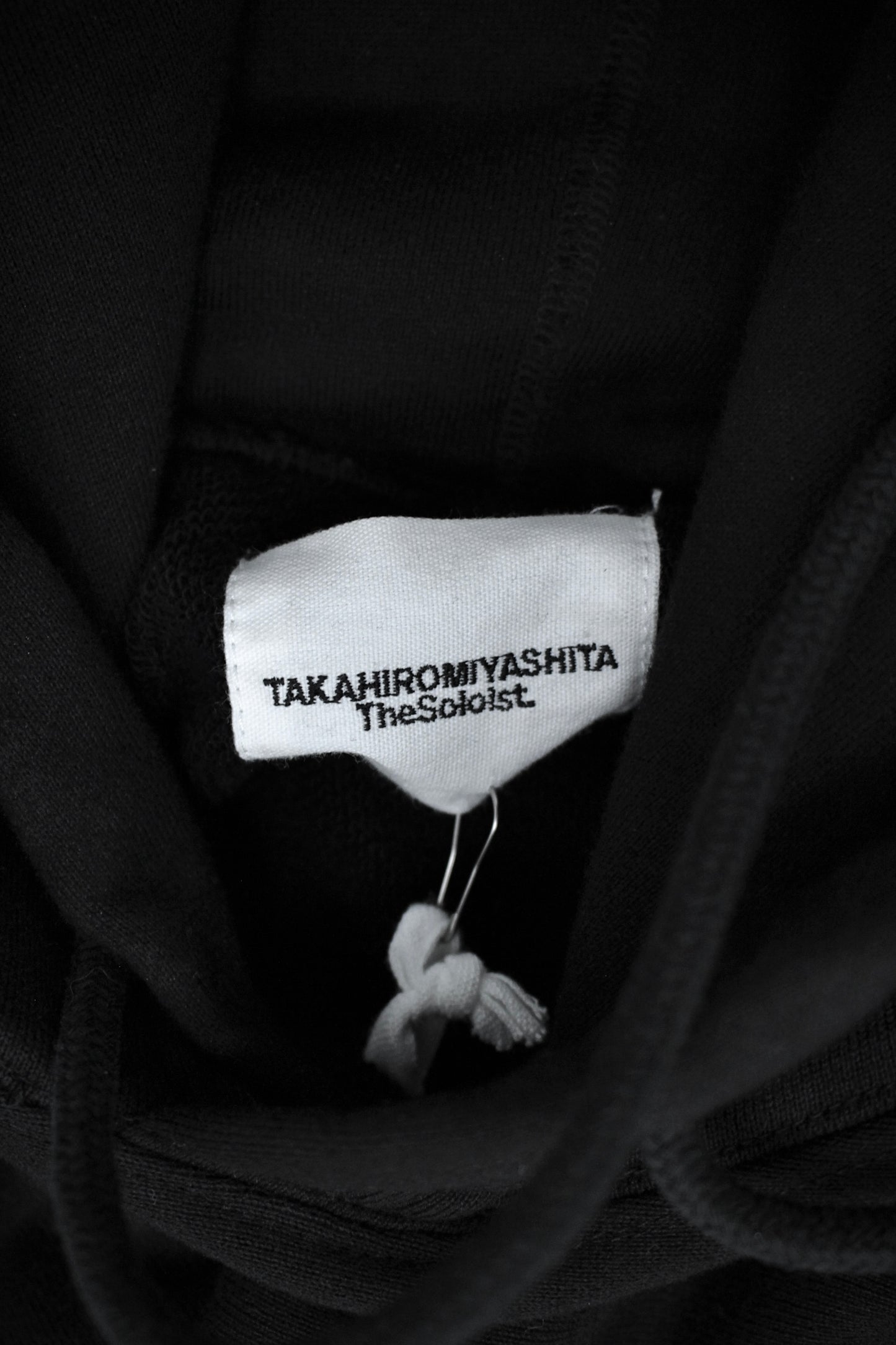TakahiroMiyashita TheSoloist. SS25 "PLAINSONG" Cotton Terry Raglan Hoodie detail | DRIEW GARMENTS