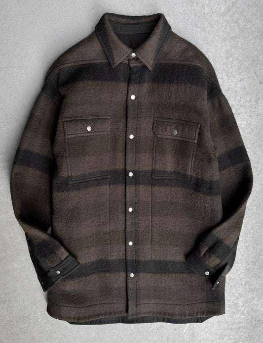Rick Owens AW23 “LUXOR” dark dust plaid oversized wool jacket, size IT 50 (XL), features chest pockets and buttoned cuffs. In flawless condition, laid flat on a light gray surface.