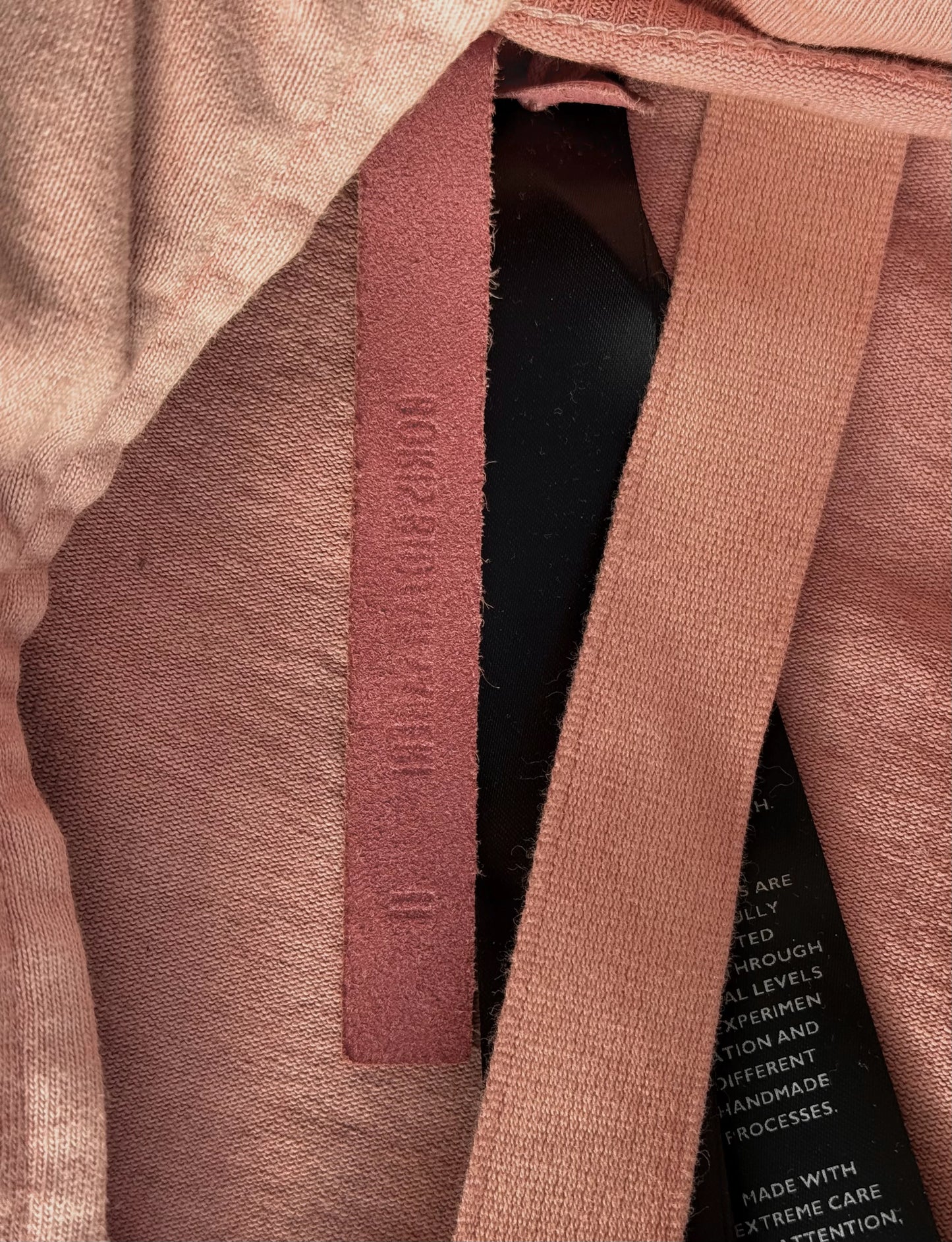 Close-up of a textured fabric with a visible brand label.