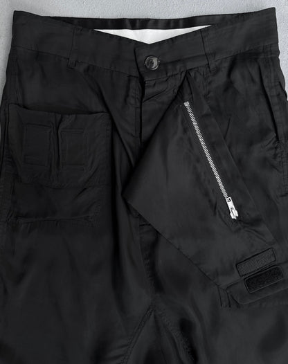 Close-up of Rick Owens SS14 “VICIOUS” Lightweight Memphis Shorts in black, size US 28-29 (IT40), featuring a front zipper partially open, buttoned waistband, and left pocket with two stitched sections. Fabric is lightweight and smooth.
