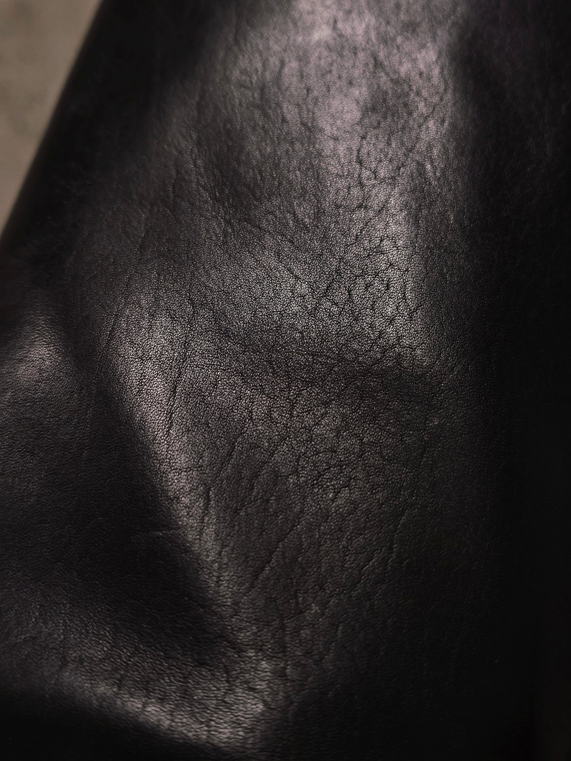 Close-up of a textured black leather surface