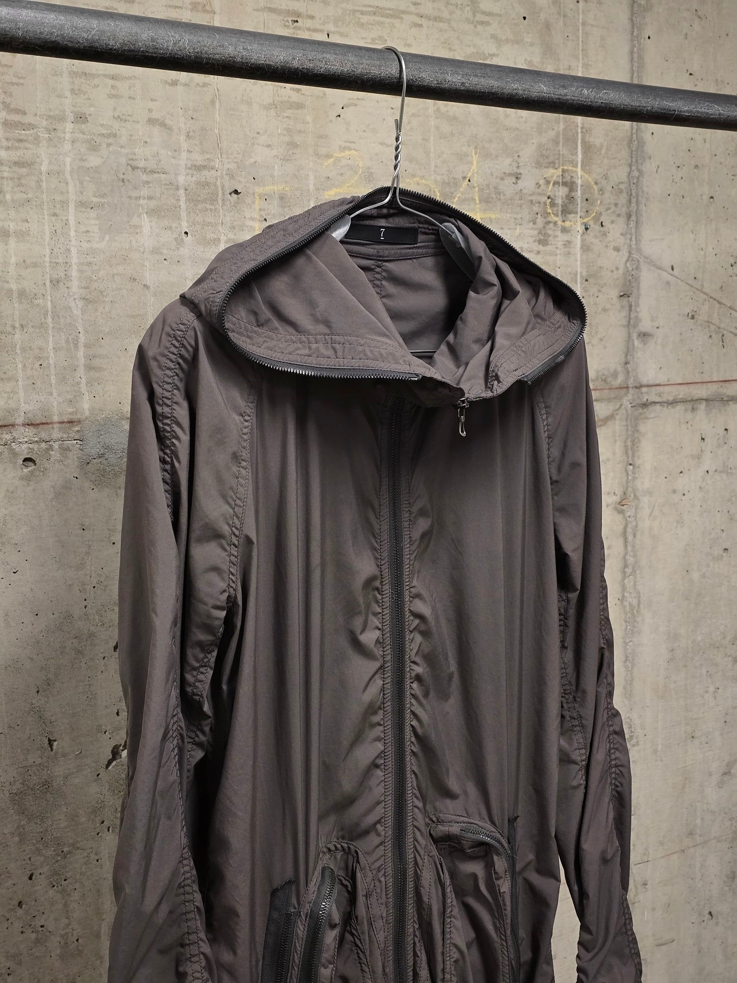 Julius_7 SS08 “Insanity In Industrial Inc.” Grey Hooded Poly Dual Zip Cargo Jacket
