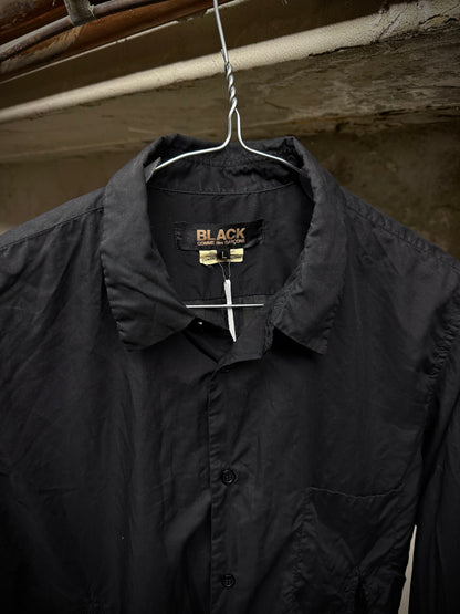 COMME des GARÇONS BLACK COMME des GARÇONS SS19 Distressed Side Cut-Out Shirt detail | DRIEW GARMENTS
