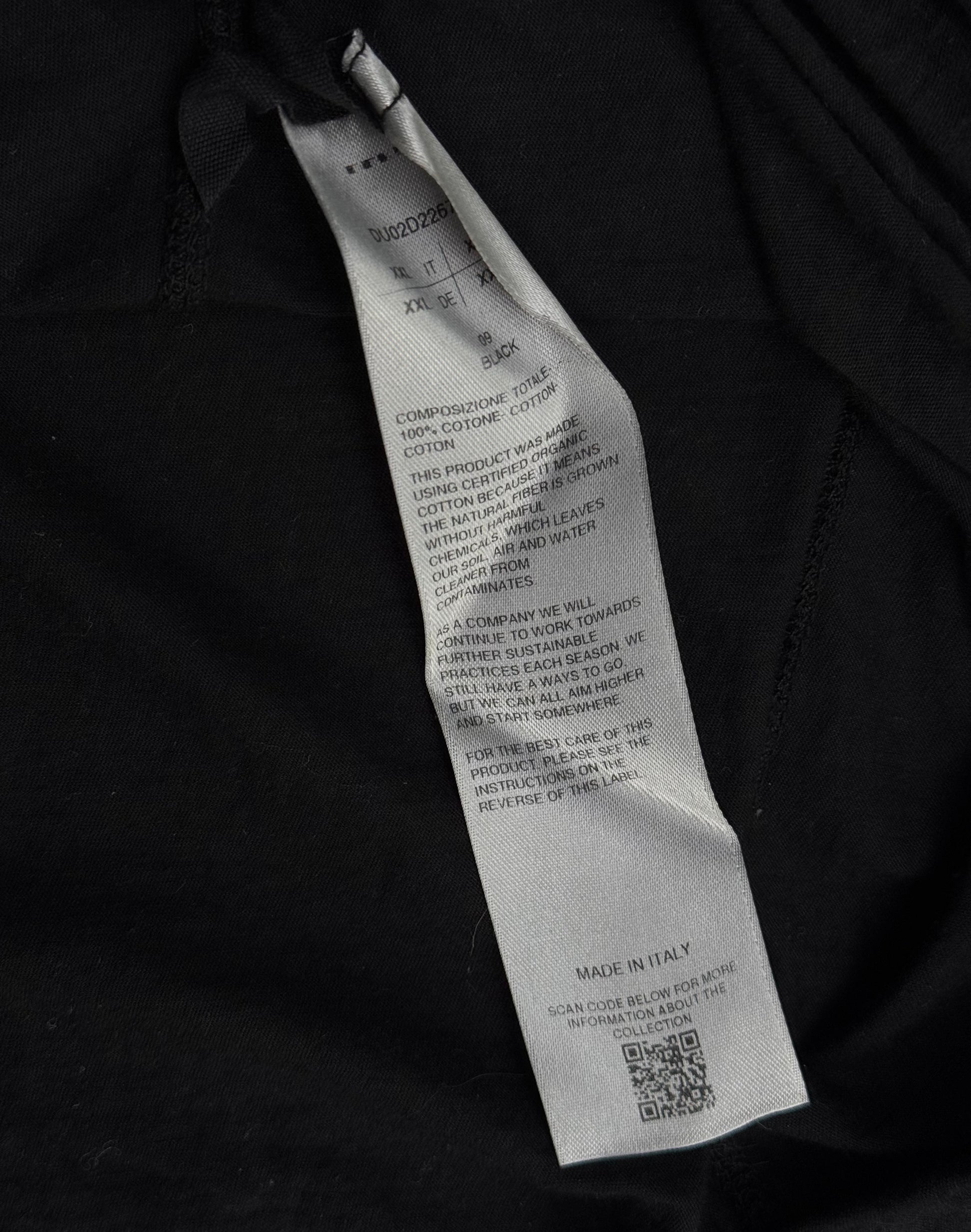A close-up of a gray care label on Rick Owens DRKSHDW AW24 “PORTERVILLE” Geometric Level Long-sleeves shows washing instructions, material details, a QR code, and Made in Italy, showcasing the brands signature style.