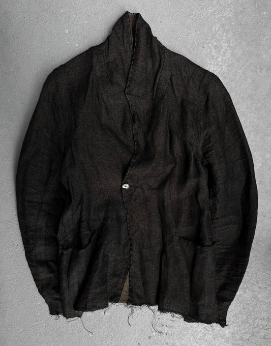 The TaichiMurakami “Coin” Taped Seam Collarless Work Blazer in black Japanese linen features raw, frayed edges, exposed seams, a single fastened button, and two front pockets for an industrial minimalist look.