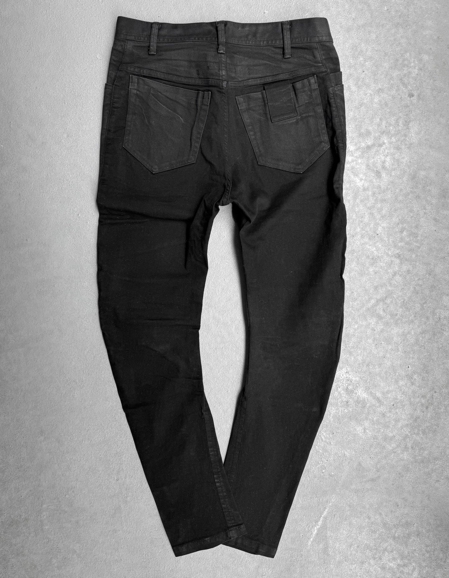 Julius_7 SS17 “Knives;” Distressed Wax Knee-Panel Skinny Denim