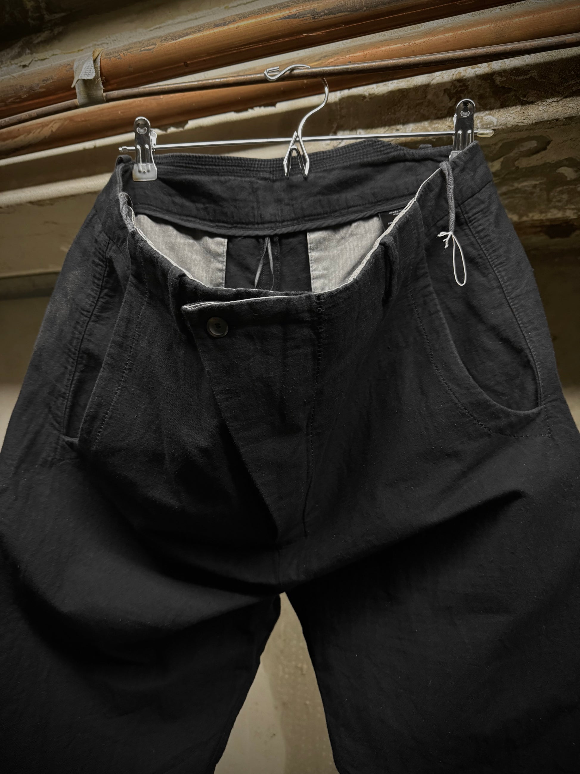 Masnada Washed Black Asymmetric Fly Overlock J-cut Pants detail | DRIEW GARMENTS