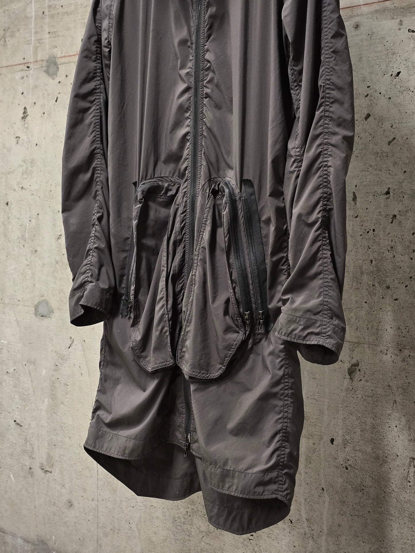 Julius_7 SS08 “Insanity In Industrial Inc.” Grey Hooded Poly Dual Zip Cargo Jacket