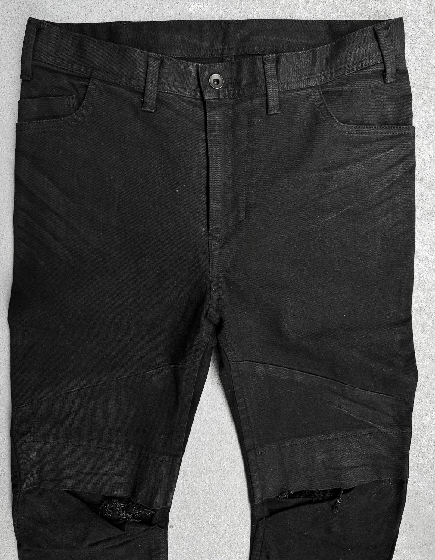 Julius_7 SS17 “Knives;” Distressed Wax Knee-Panel Skinny Denim