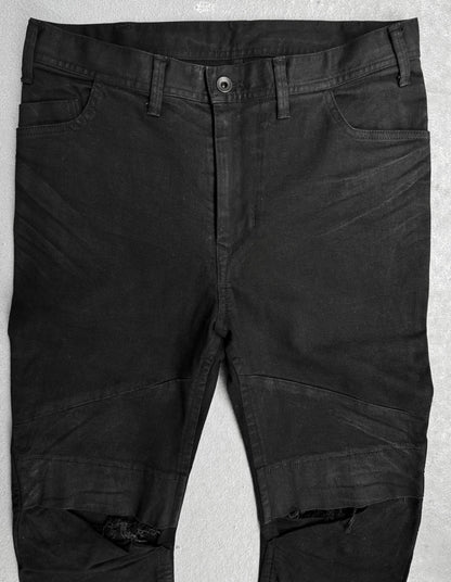 Julius_7 SS17 “Knives;” Distressed Wax Knee-Panel Skinny Denim