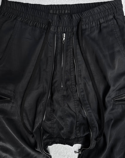 DRIEW Julius_7 SS10 “neurbanvolker;” Convertible Multi-zip Cotton Twill Shorts in flawless condition with low crotch, exposed front zip, drawstrings, elastic waist (fits US 29-32), and side zippers. Displayed on a light surface.