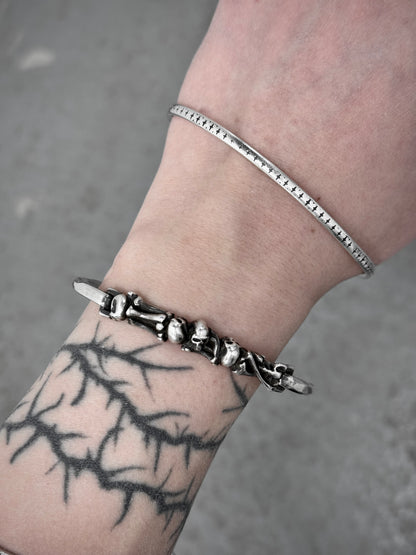 WERKSTATT:MÜNCHEN 2010s .925 Silver Skull & Bones Hook Bracelet (Older Model) detail | DRIEW GARMENTS