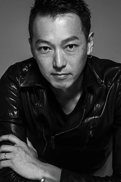 Portrait image of designer Kazuhisa Komura for clothing brand 5351 Pour Les Hommes - Known for rockstar designs 