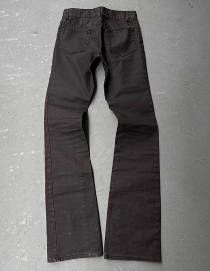 Dark gray pants on a textured gray surface