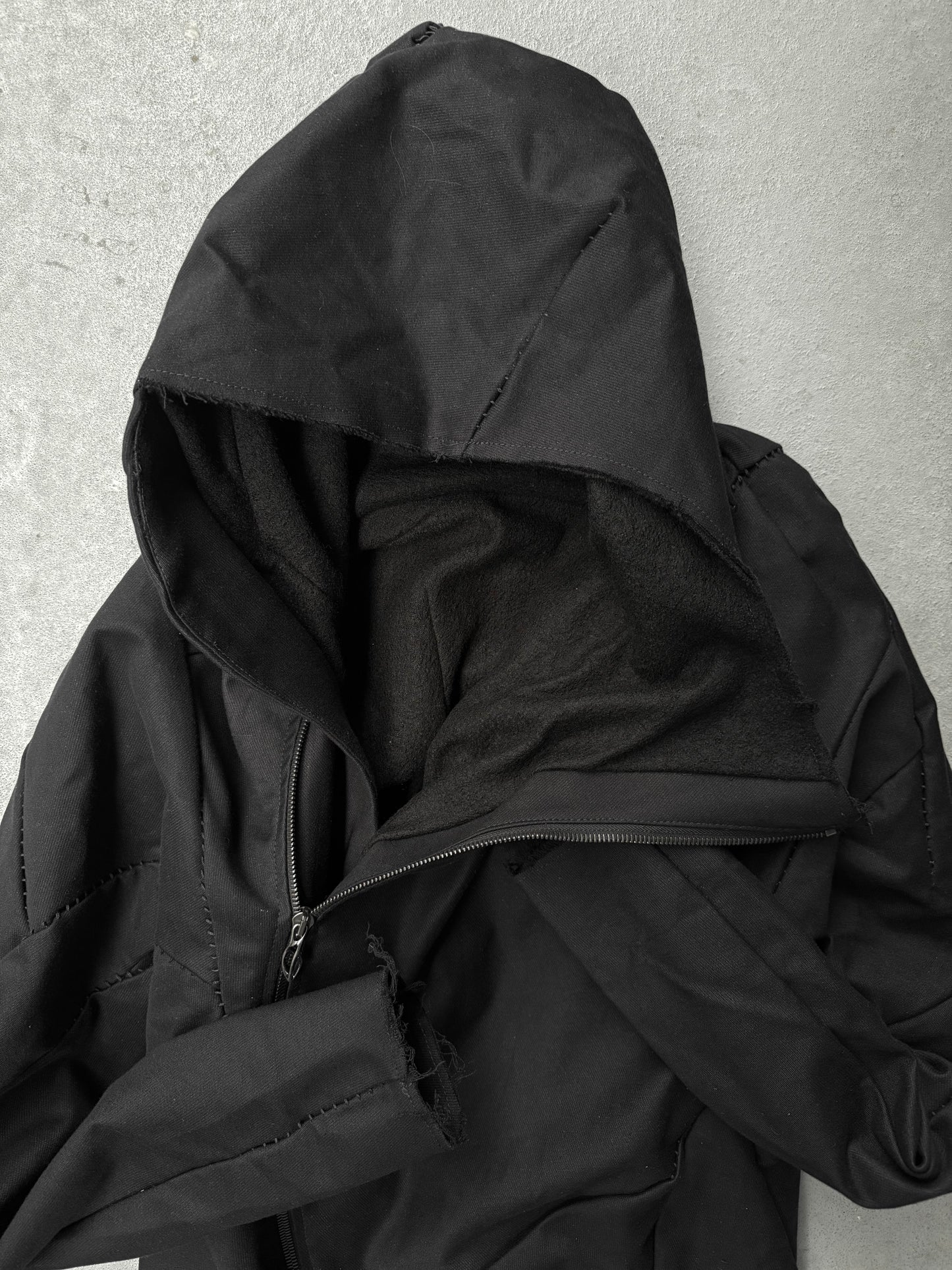 LEON EMANUEL BLANCK Distortion Curved Overlock Wool Lined Hooded Coat detail | DRIEW GARMENTS