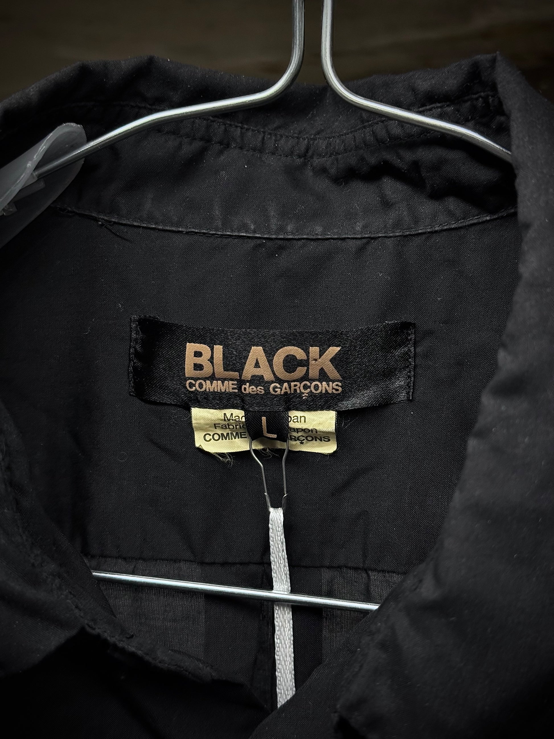COMME des GARÇONS BLACK COMME des GARÇONS SS19 Distressed Side Cut-Out Shirt detail | DRIEW GARMENTS