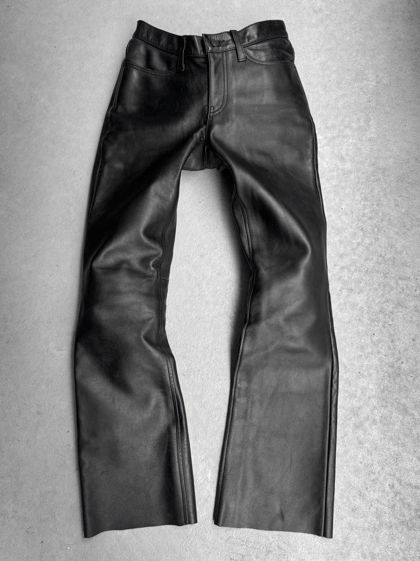 Black leather pants on a gray background