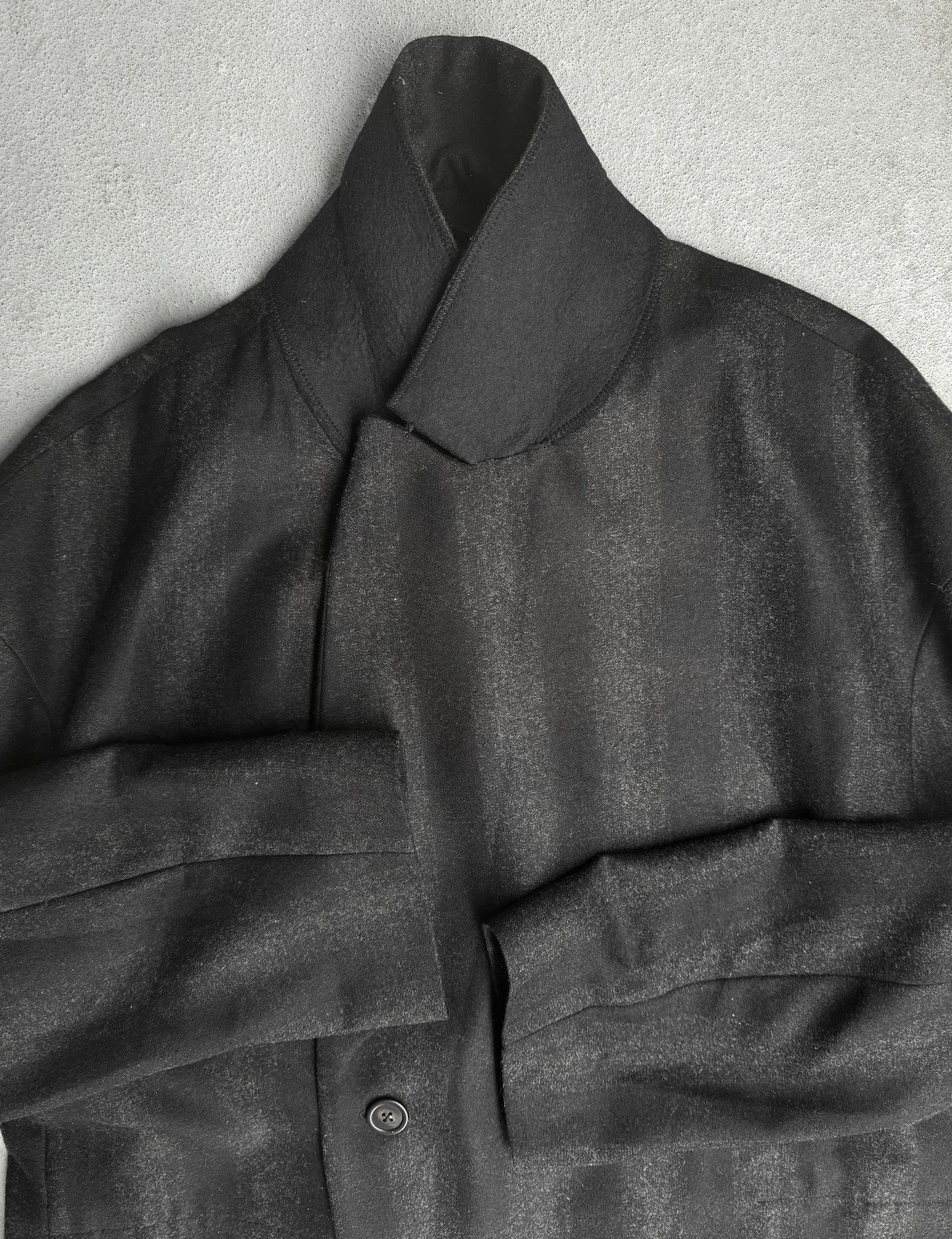 Dark gray coat with a collar on a light gray background