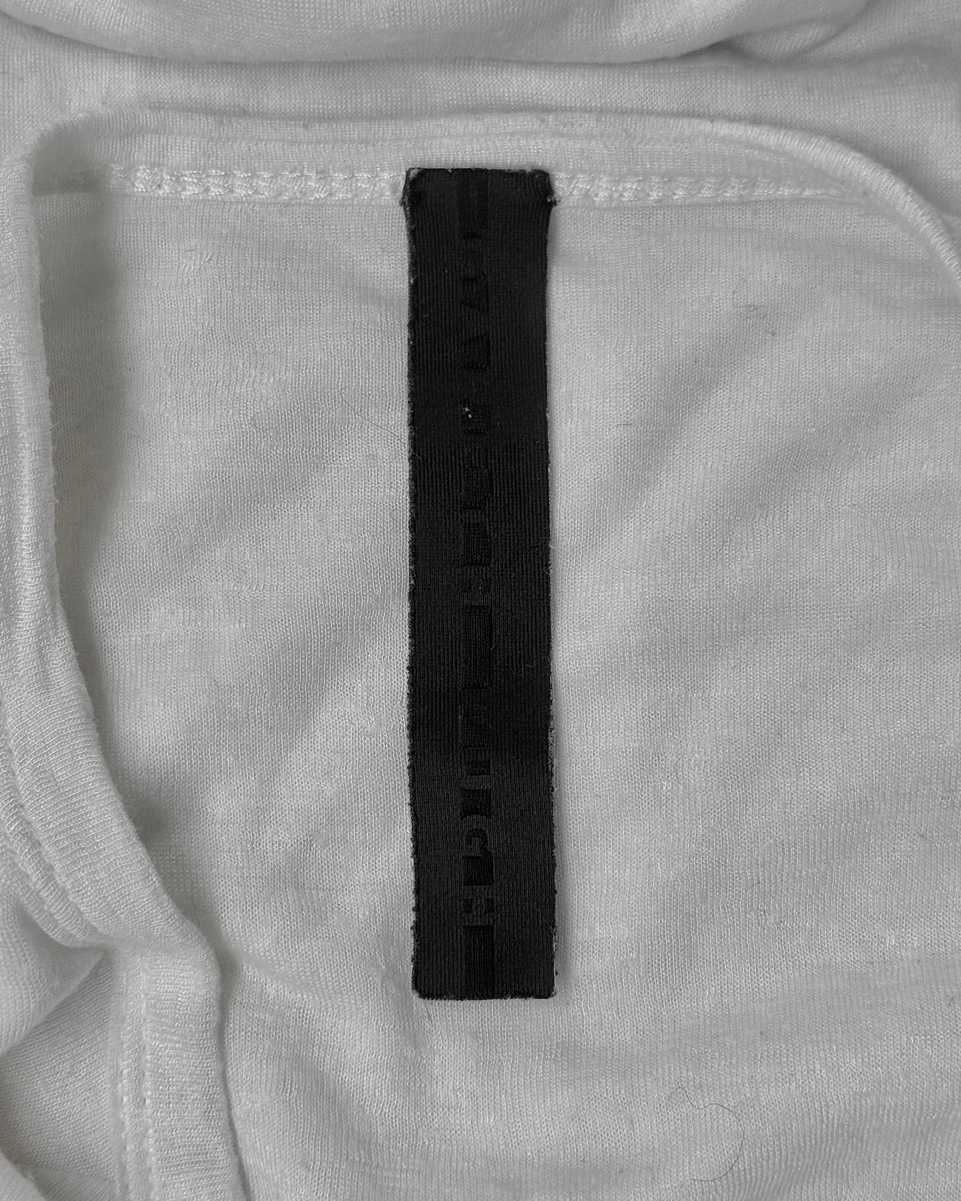 Close-up of a black label on gray fabric