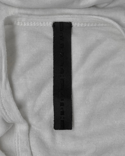Close-up of a black label on gray fabric