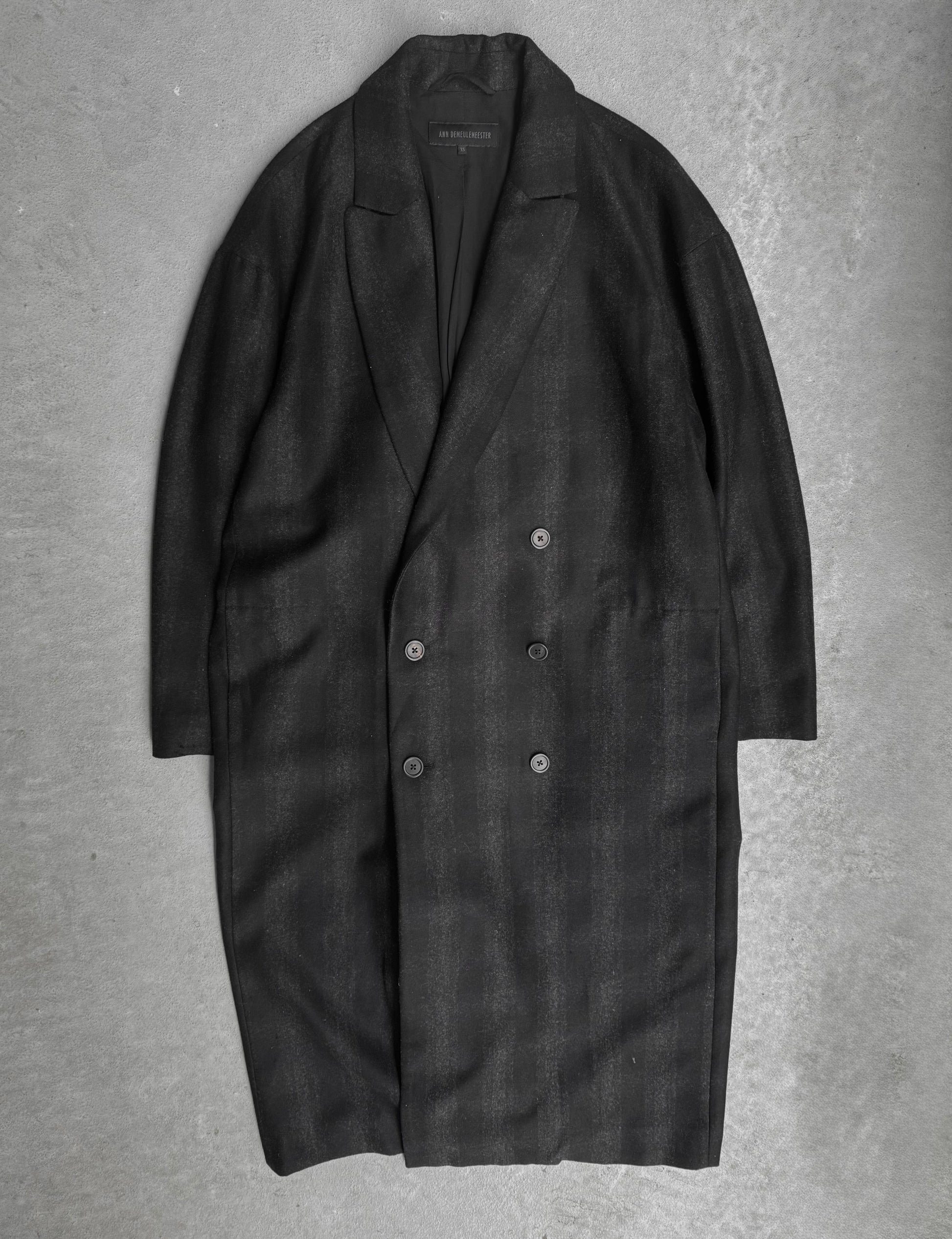 Dark gray coat on a textured gray background