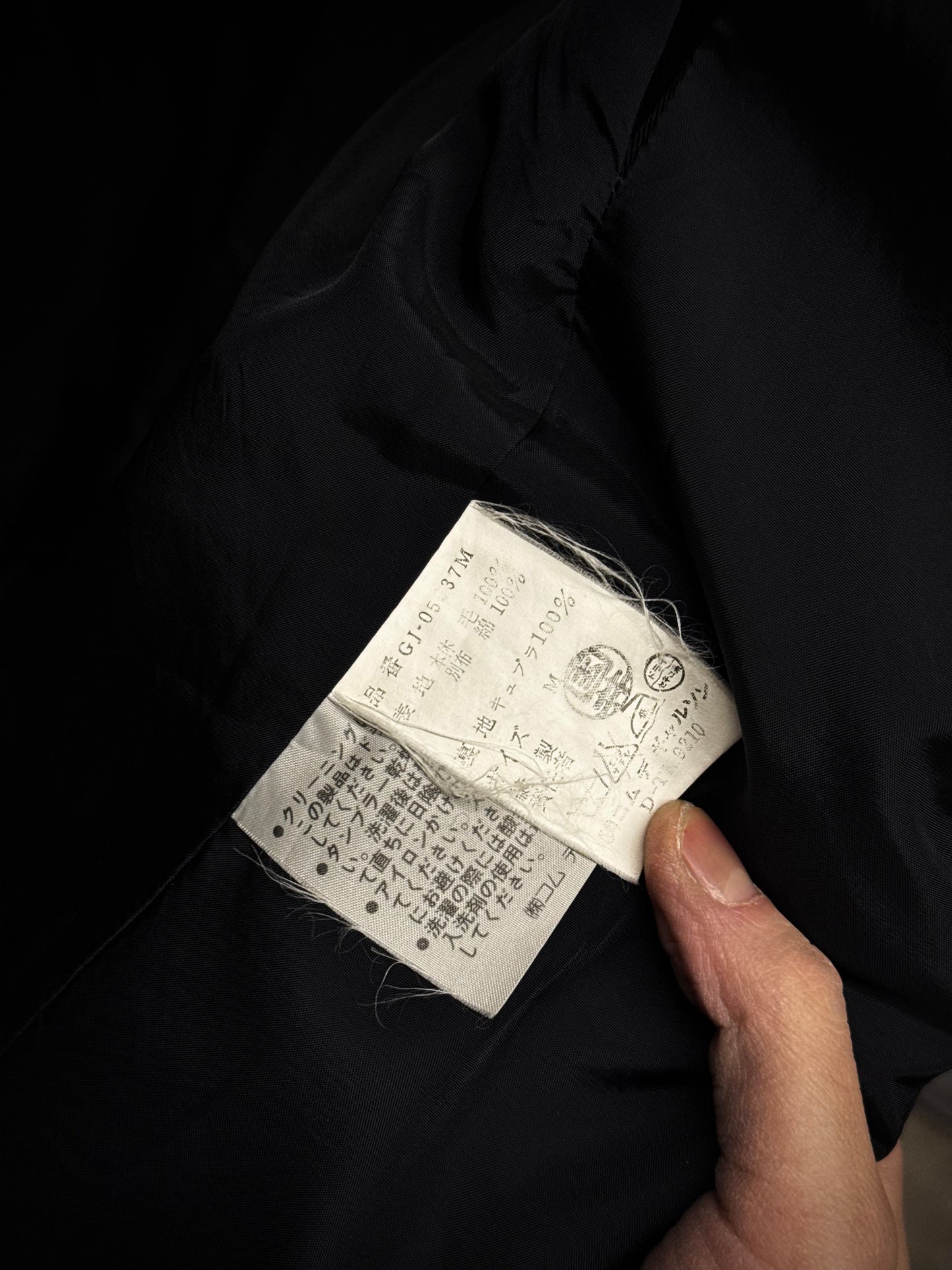 COMME des GARÇONS Late 80s 'Jean Paul Gaultier' Woven Tag Asymmetric Open-front Blazer detail | DRIEW GARMENTS