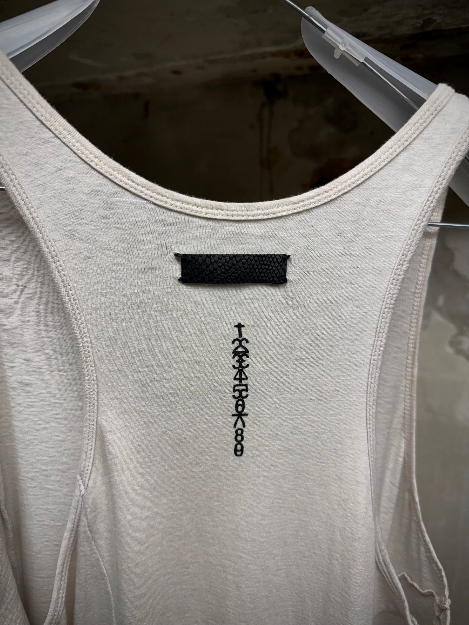 IfSixWasNine 'No. BONE-2/TK/M' Asymmetrical Raw Hem Cut Tank Top detail | DRIEW GARMENTS
