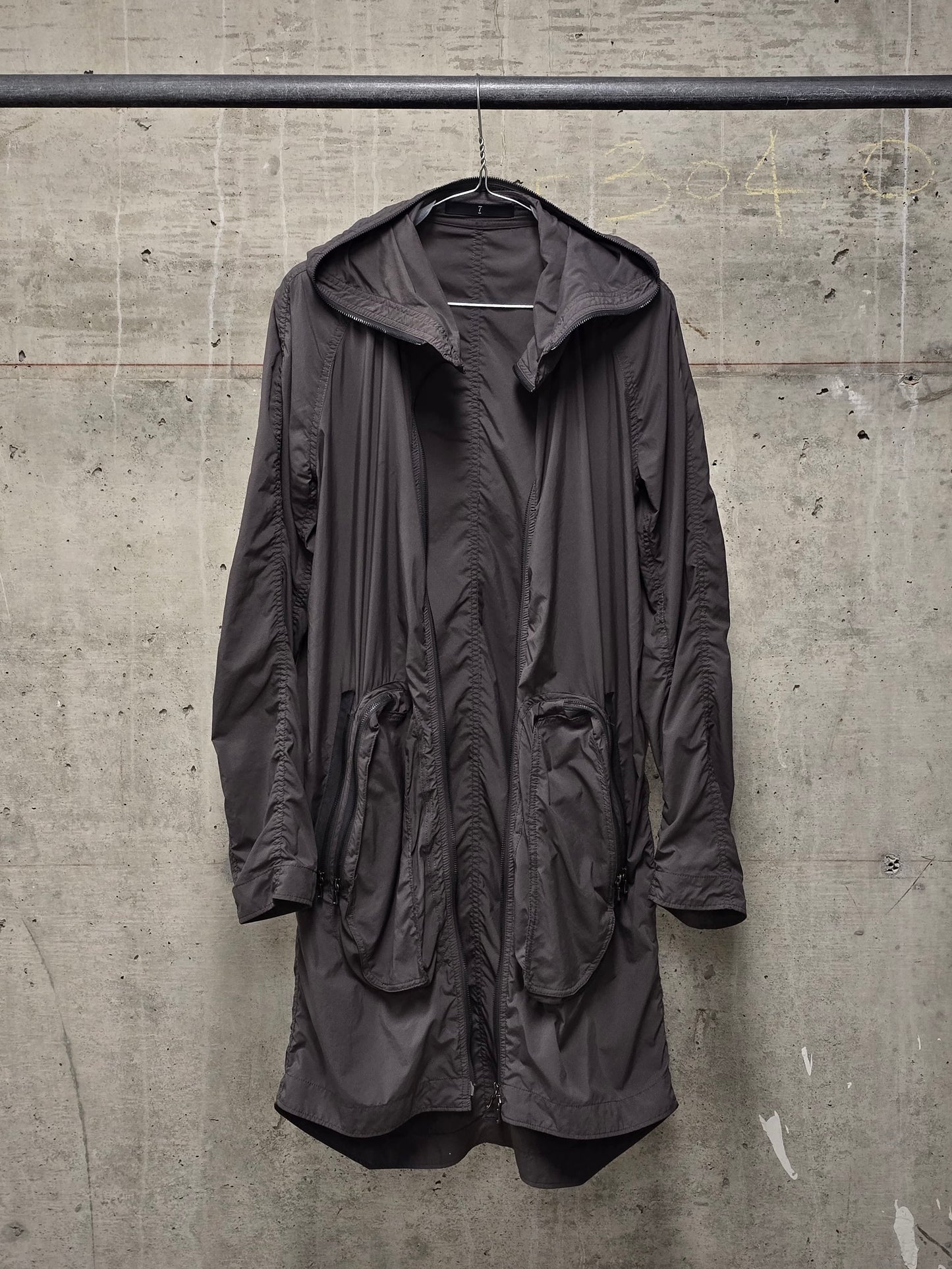 Julius_7 SS08 “Insanity In Industrial Inc.” Grey Hooded Poly Dual Zip Cargo Jacket