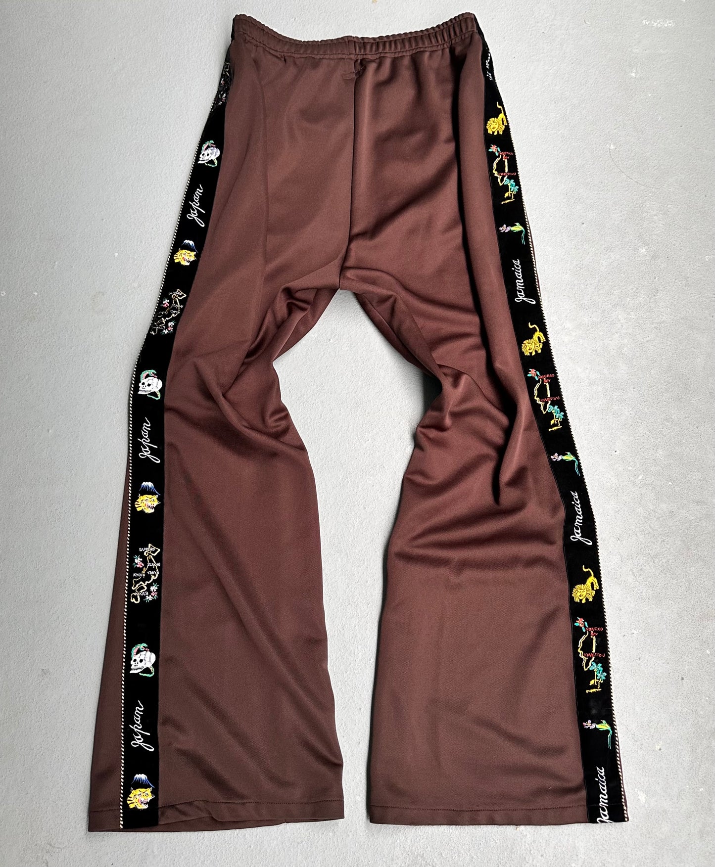 KAPITAL Velour Side Ska-Tape “Jamaica-Japan” Flare Jersey Track Pants