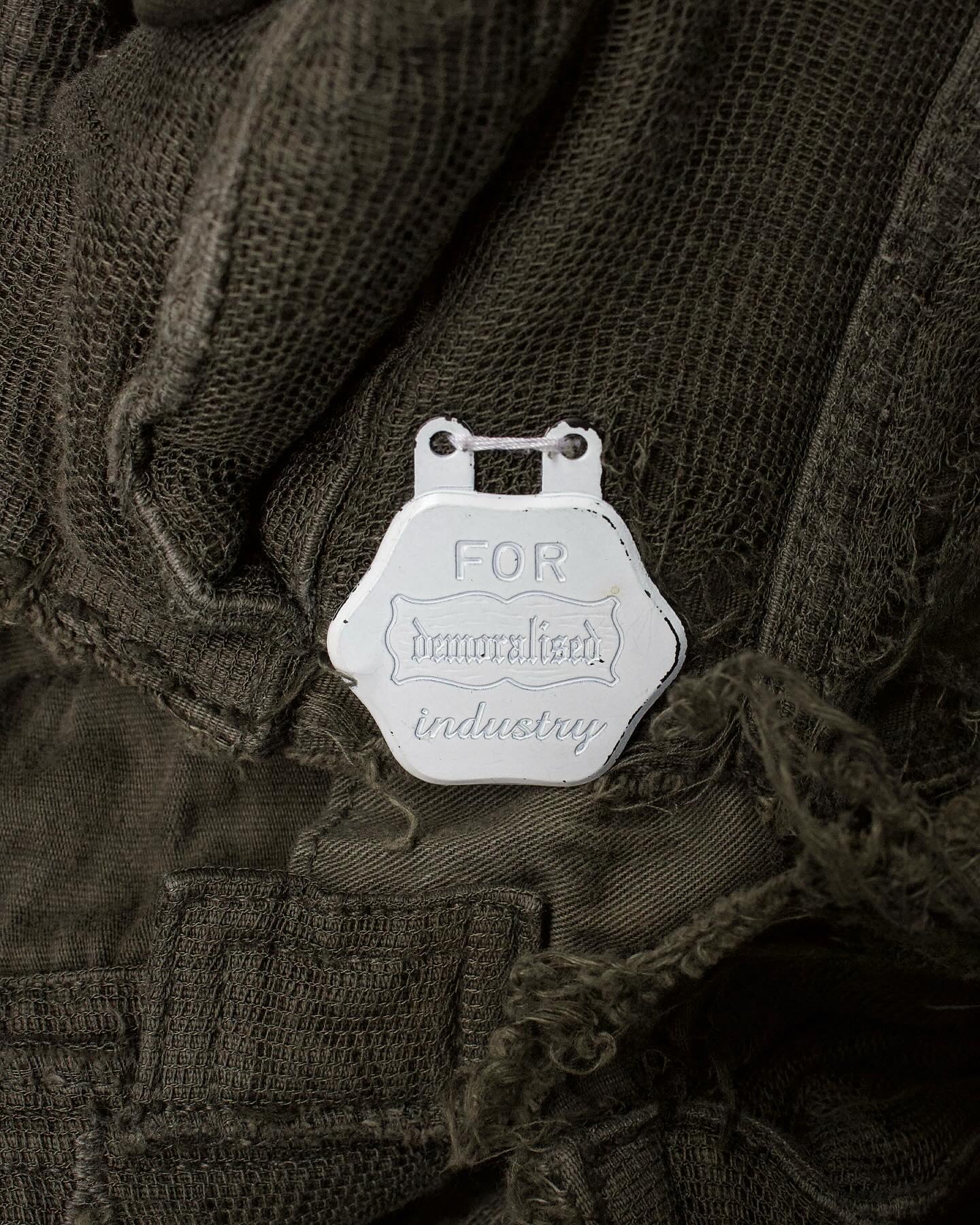 Mihara Yasuhiro AW05 Distressed Layered Mesh Military Jacket (Olive) detail pin tag