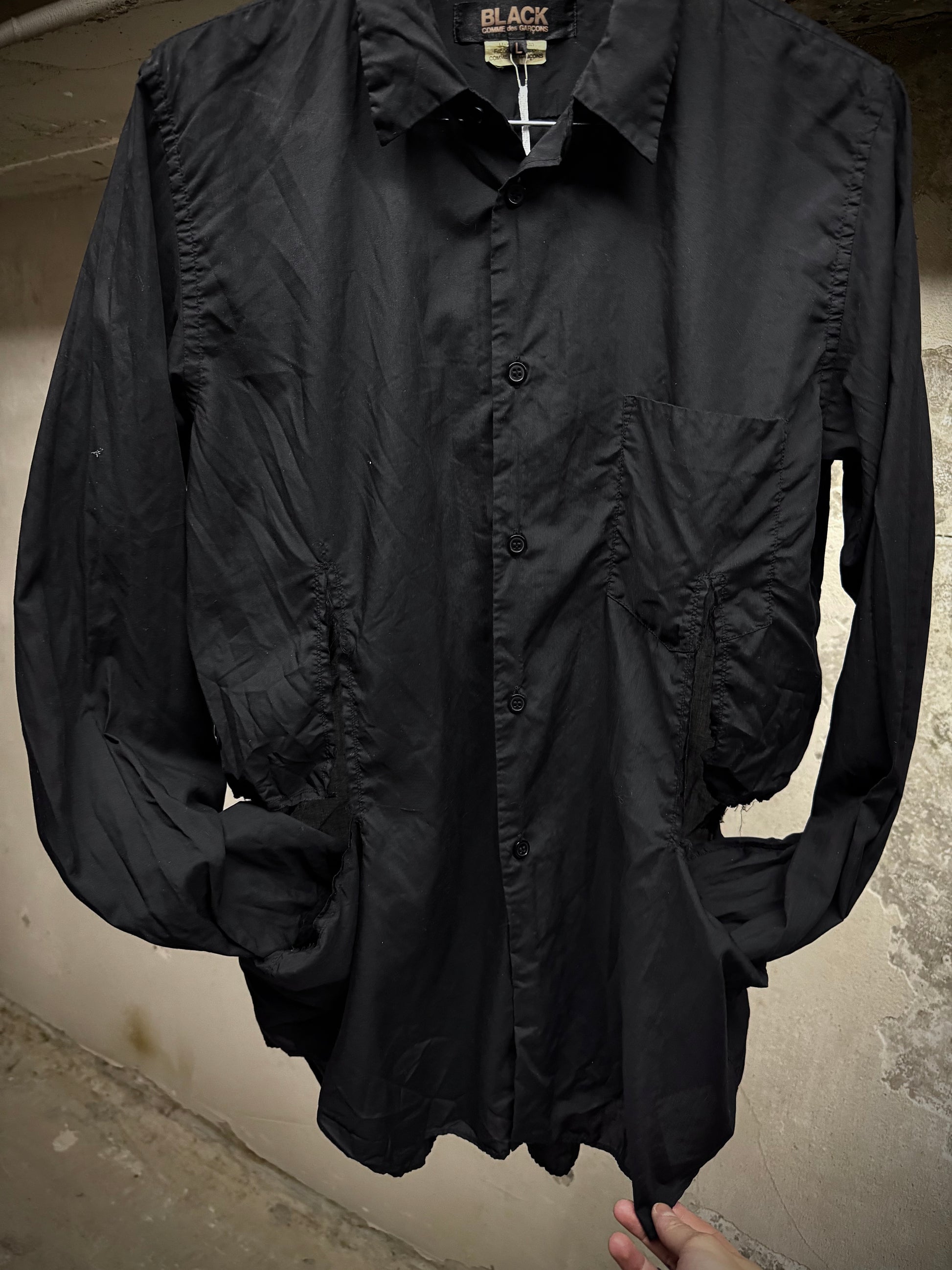 COMME des GARÇONS BLACK COMME des GARÇONS SS19 Distressed Side Cut-Out Shirt detail | DRIEW GARMENTS