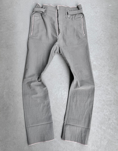 The Carol Christian Poell 2010 “IN-BETWEEN” PM/2578 PEDGE Self-edge High-waisted Metre Pants feature white stitching, a front zipper, belt loops, and two zippered pockets—exemplifying avant-garde materials and design from Carol Christian Poell.