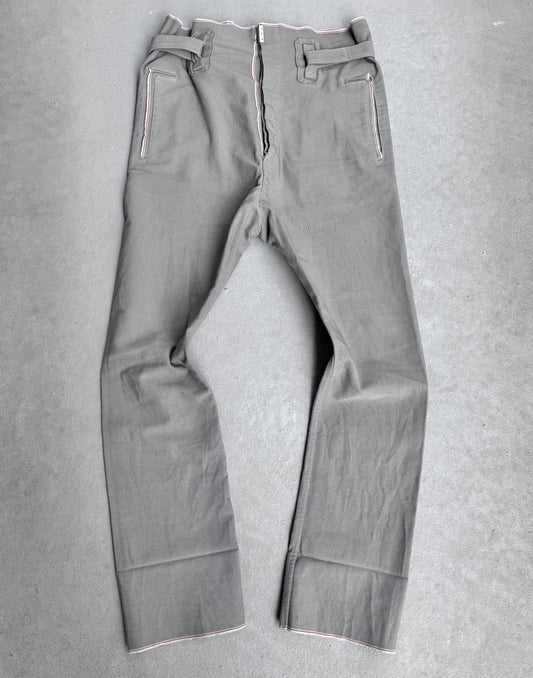 The Carol Christian Poell 2010 “IN-BETWEEN” PM/2578 PEDGE Self-edge High-waisted Metre Pants feature white stitching, a front zipper, belt loops, and two zippered pockets—exemplifying avant-garde materials and design from Carol Christian Poell.