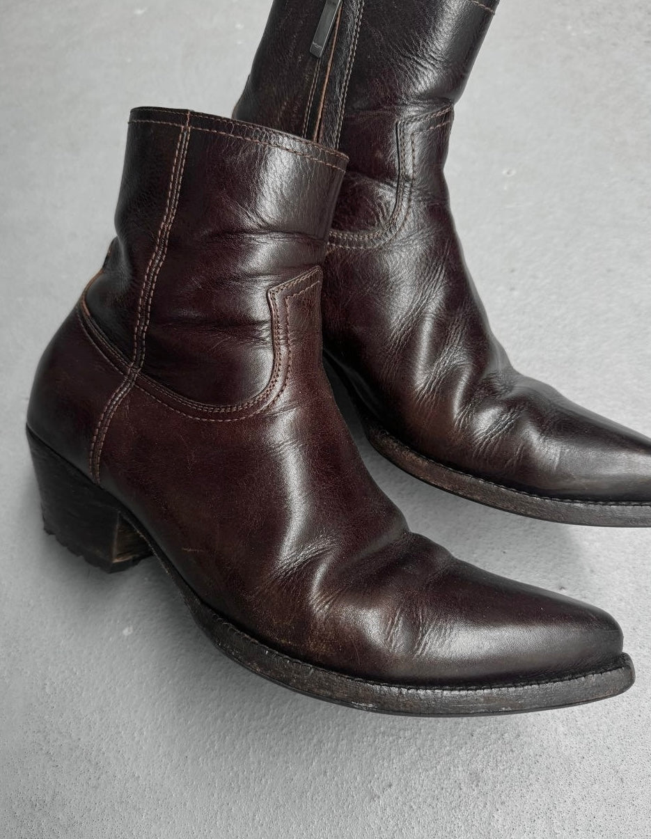 Pair of brown leather boots on a gray background