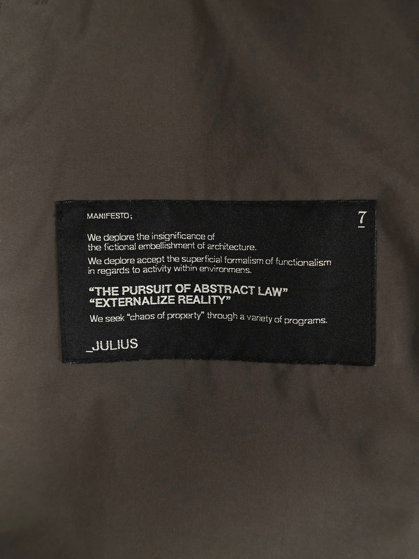 Julius_7 SS08 “Insanity In Industrial Inc.” Grey Hooded Poly Dual Zip Cargo Jacket