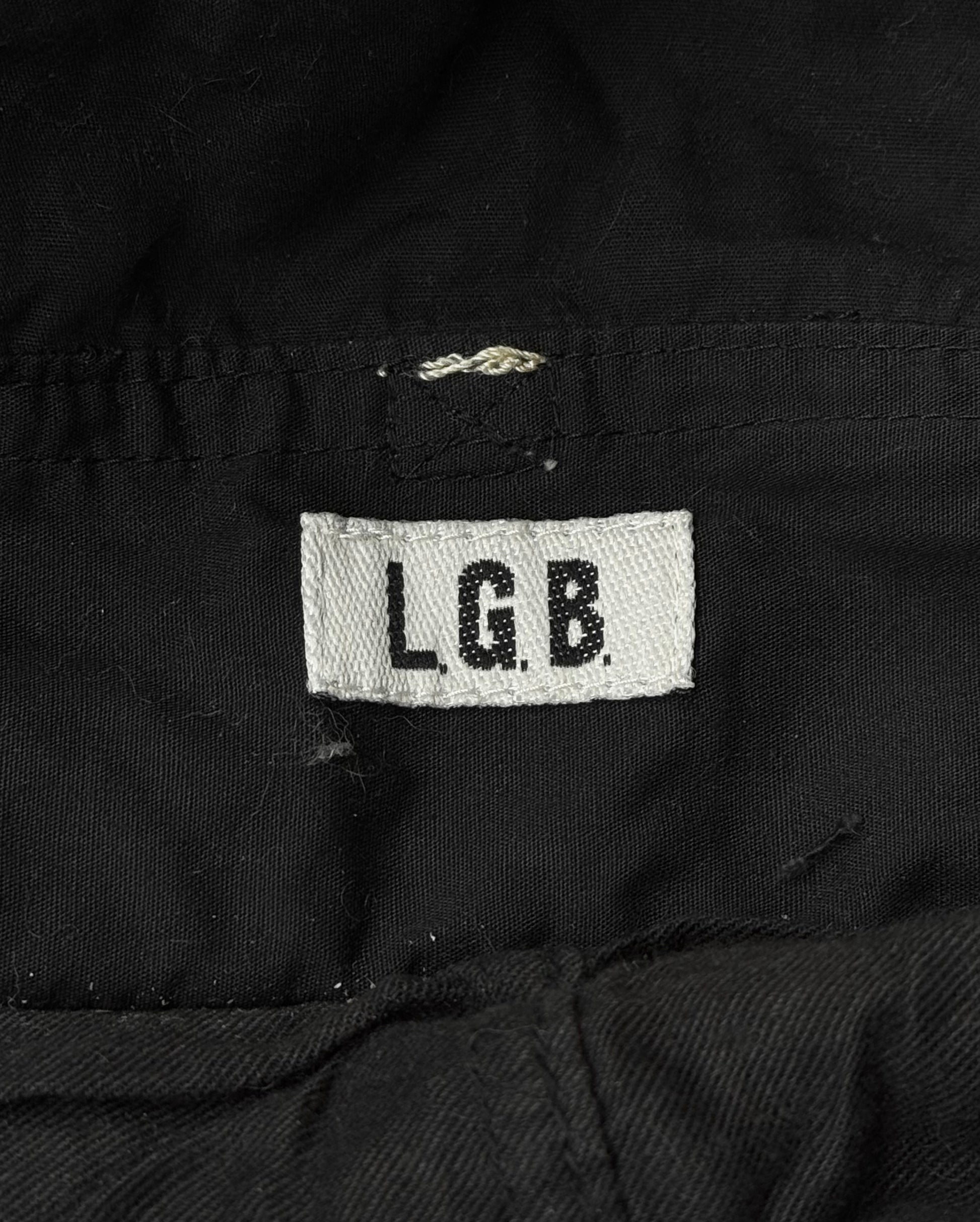 The L.G.B Early 00s Pilot Cargo Capris by L.G.B feature a white fabric tag with black L.G.B. lettering sewn onto black material and repair patches that add extra character.