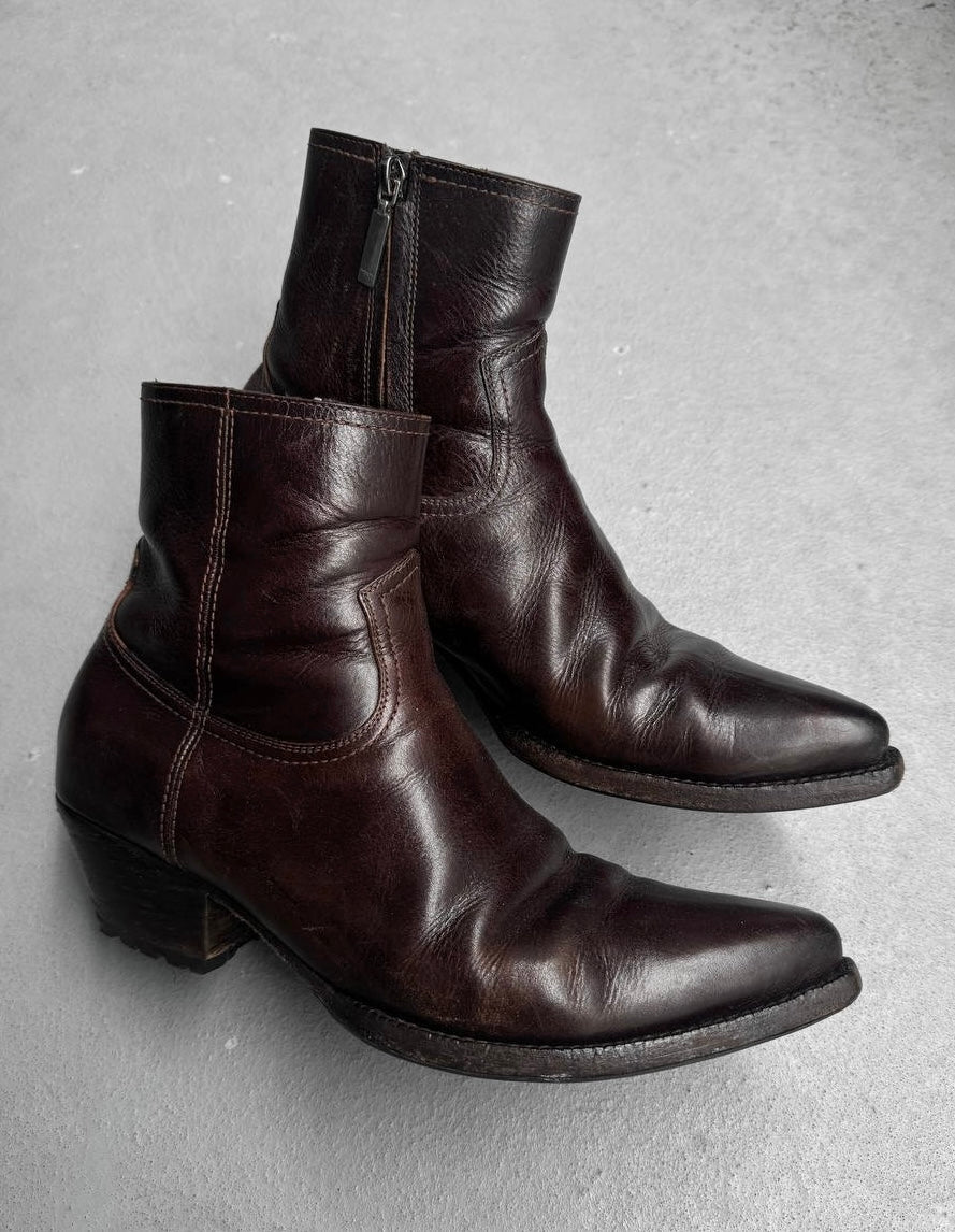 Pair of brown leather boots on a gray background