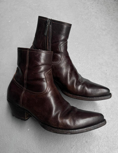 Pair of brown leather boots on a gray background