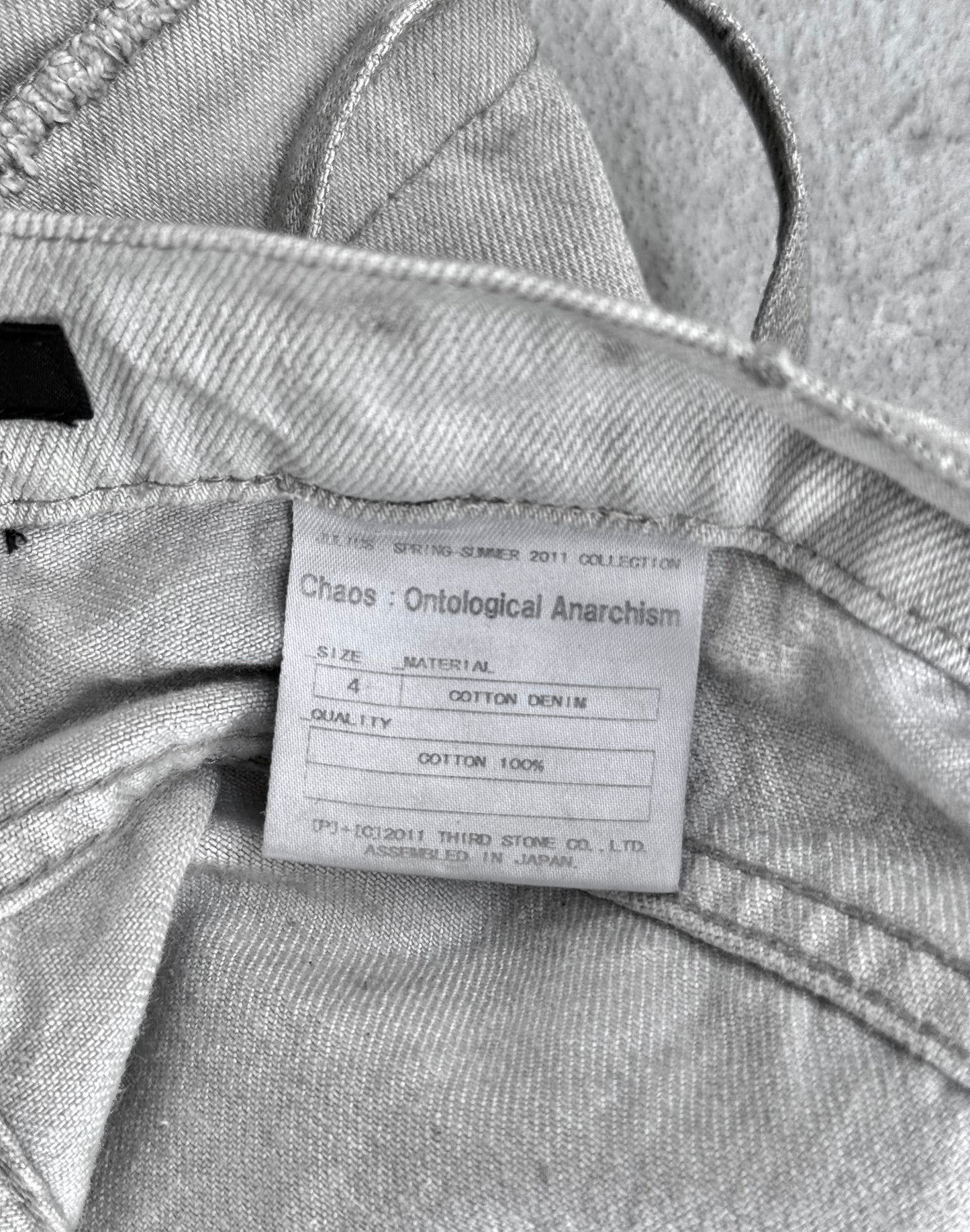 Julius_7 SS11 “Chaos : Ontological Anarchism” Distressed Knee Dirty White Bootcut Denim