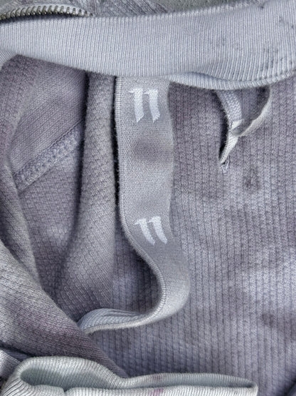 A close-up of the Boris Bidjan Saberi 11 by Boris Bidjan Saberi SS23 ‘Z1-F1235’ hand-dyed convertible hoodie in grey ribbed fabric, Size XL, featuring matching drawstrings with two white lines near the ends and a slim fit.
