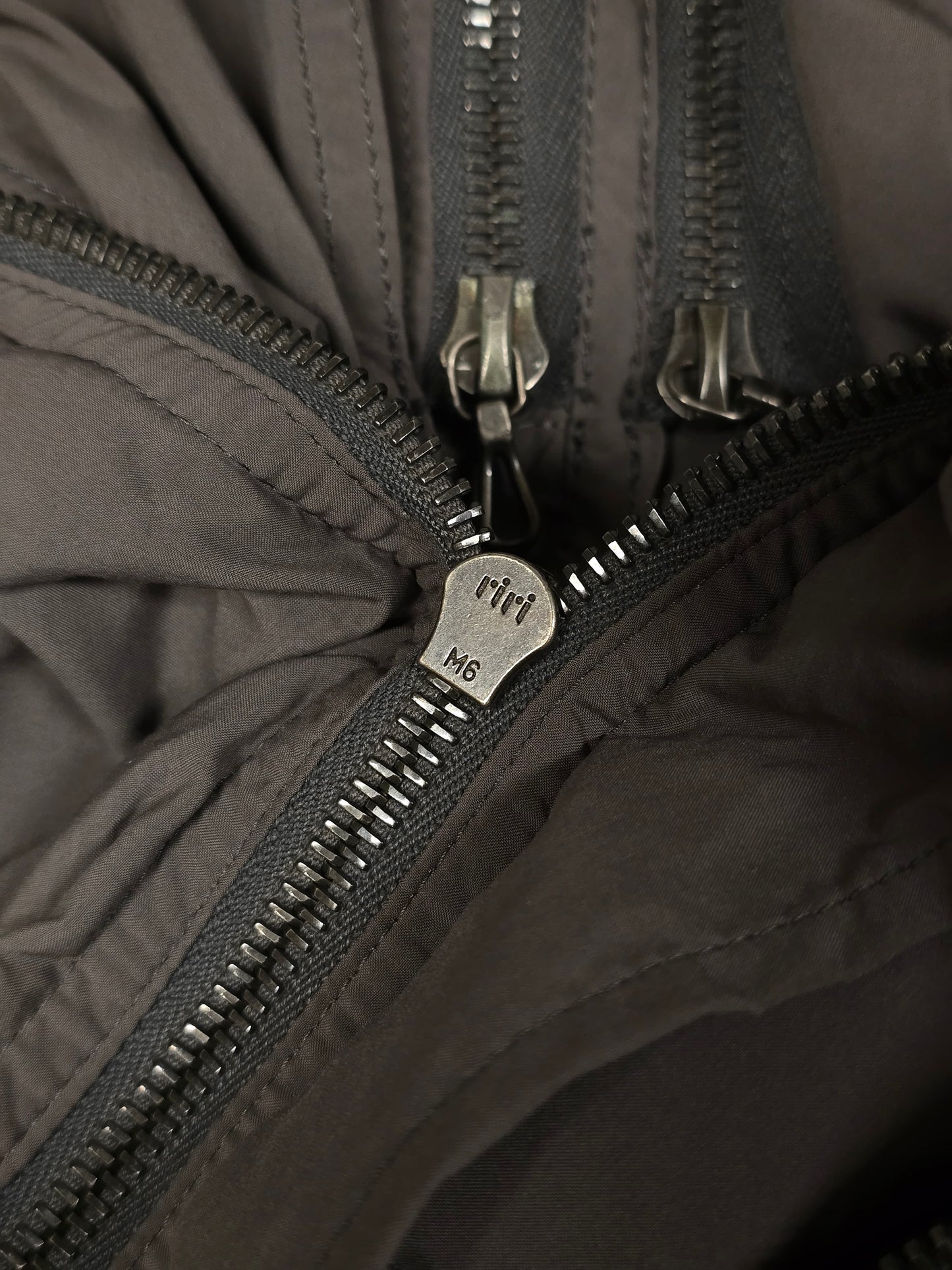 Julius_7 SS08 “Insanity In Industrial Inc.” Grey Hooded Poly Dual Zip Cargo Jacket