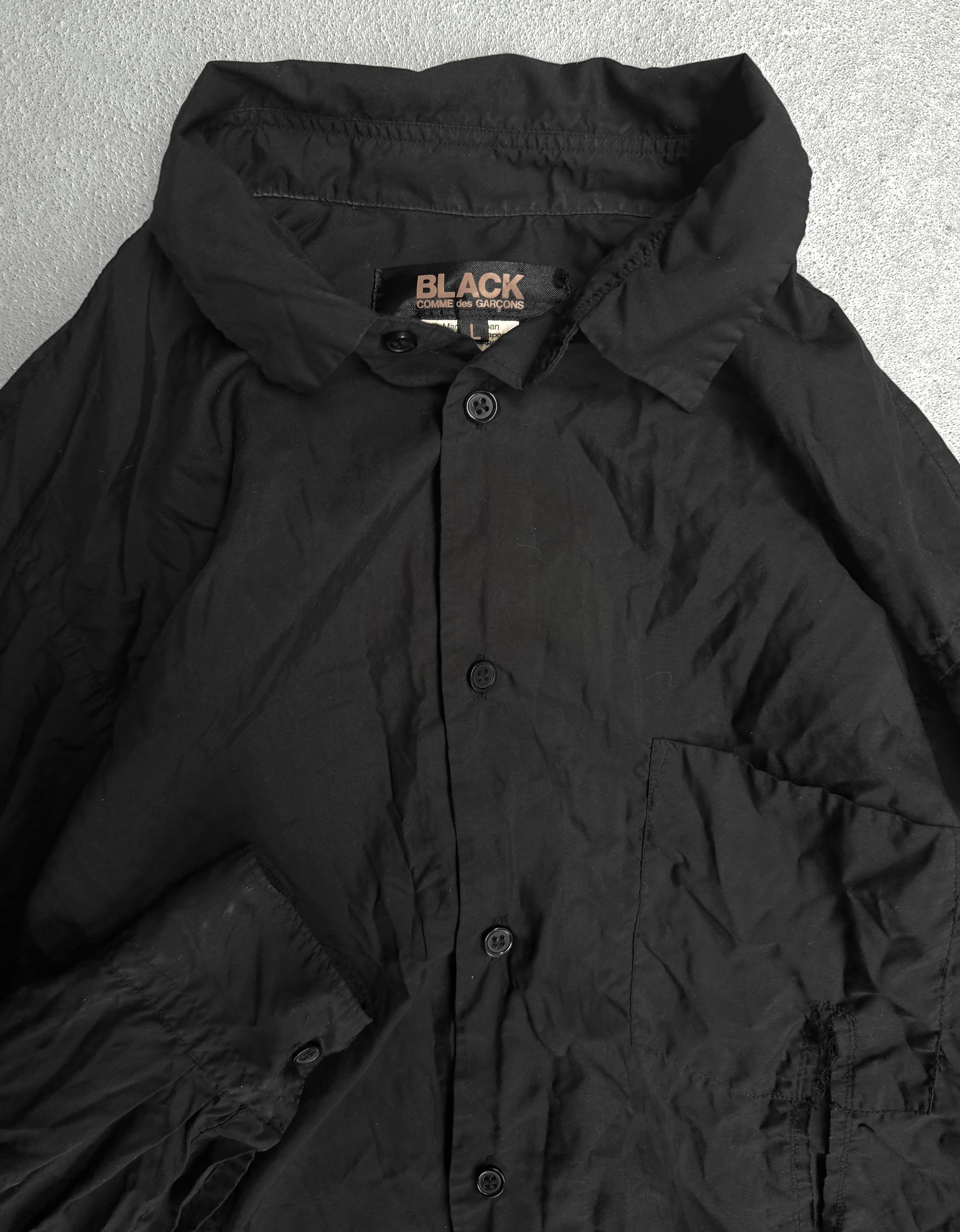 BLACK COMME des GARÇONS SS19 Distressed Side Cut-Out Shirt