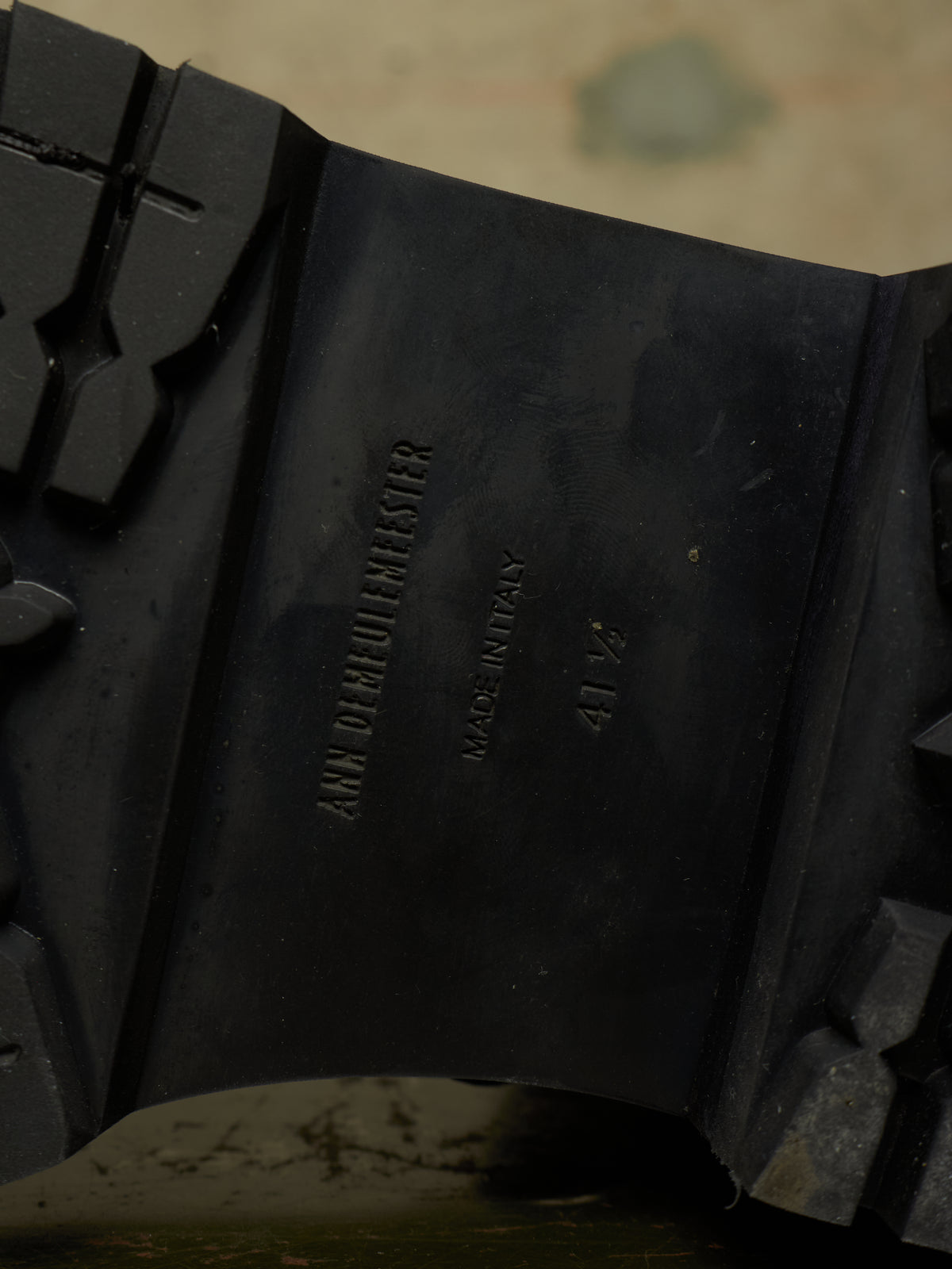 Close-up of the black rubber outsole of a boot, showing embossed text that reads 'ANNO D'ORLOGHIERO', 'MADE IN ITALY', and size '41 1/2'.