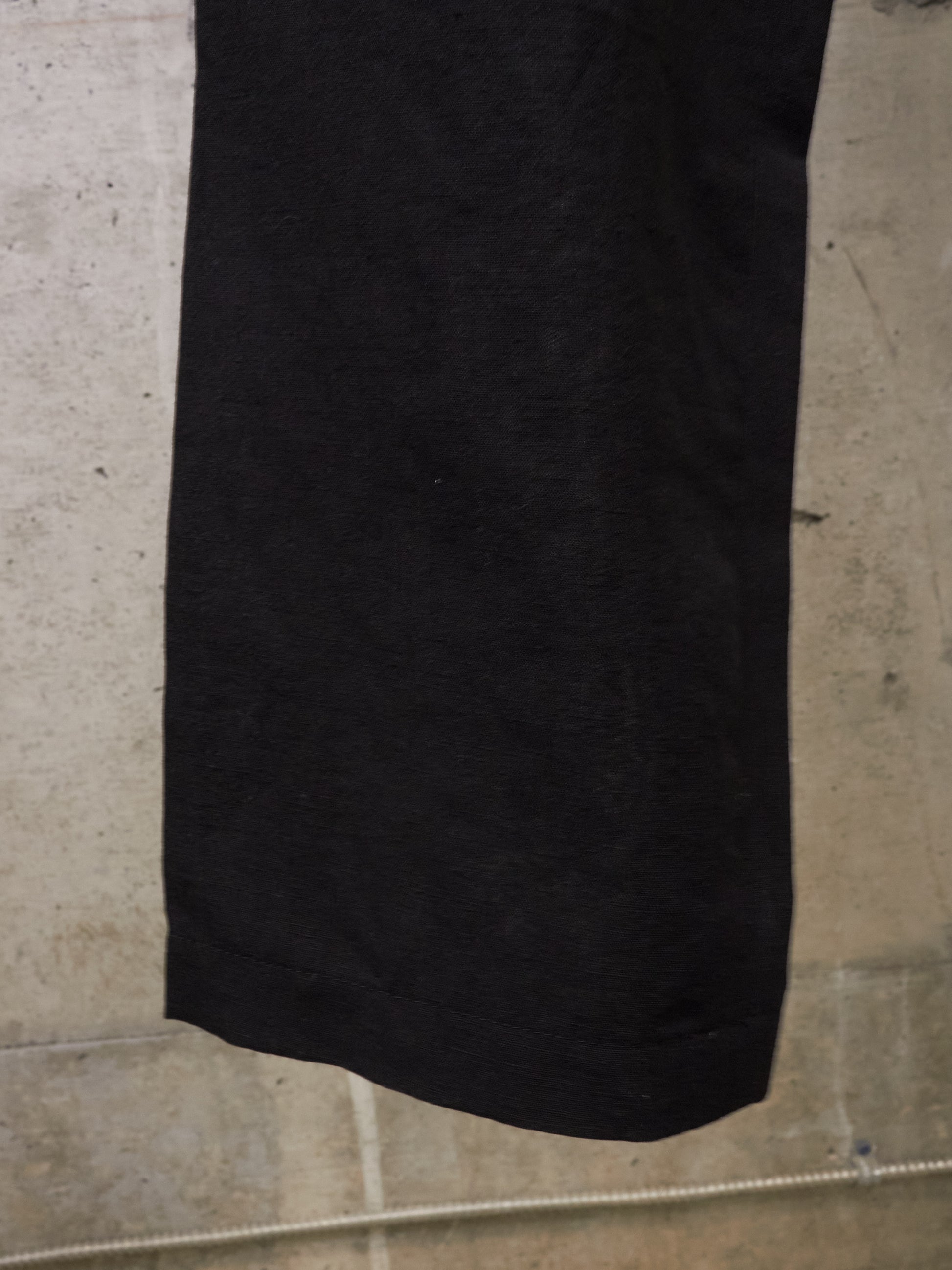 Black skirt on a light gray concrete floor