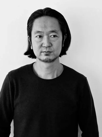 Kazuyuki Kumagai portrait black and white  - founder of Attachment - Japanese Minimalist & Tailored Clothing designer  