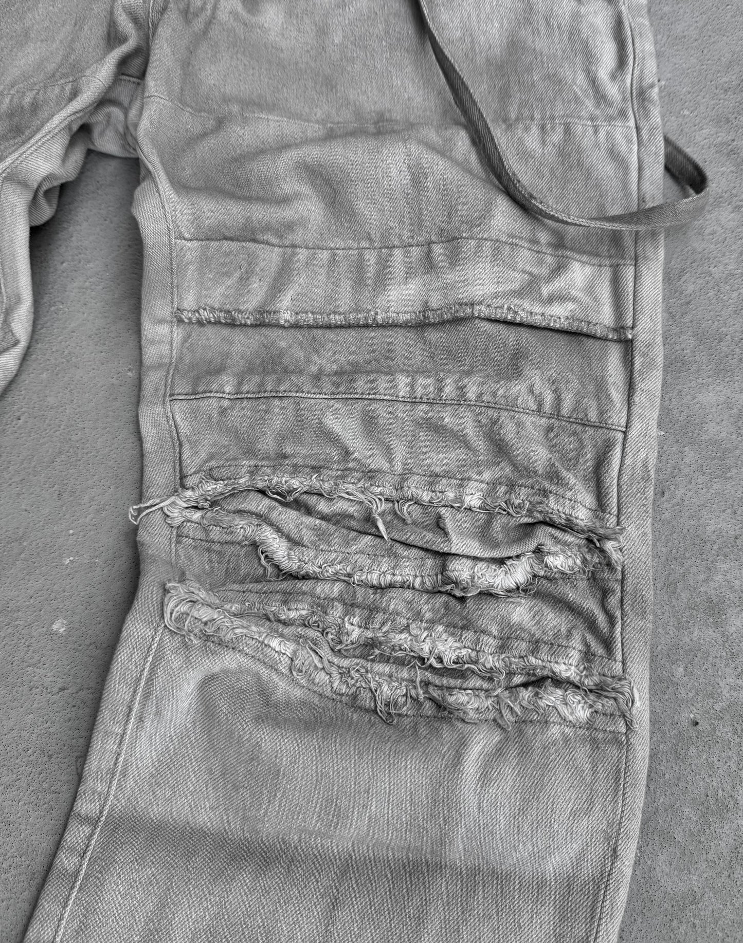 Julius_7 SS11 “Chaos : Ontological Anarchism” Distressed Knee Dirty White Bootcut Denim